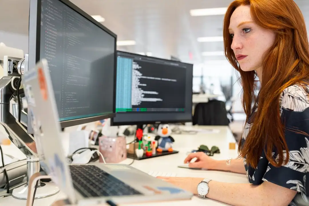 A developer working calmly at a laptop